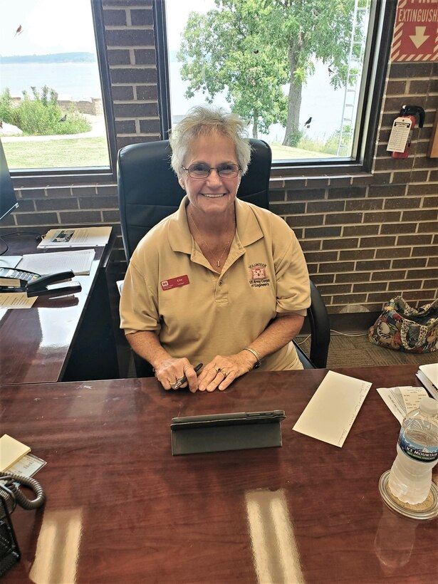 Smiling volunteer staffing visitor center