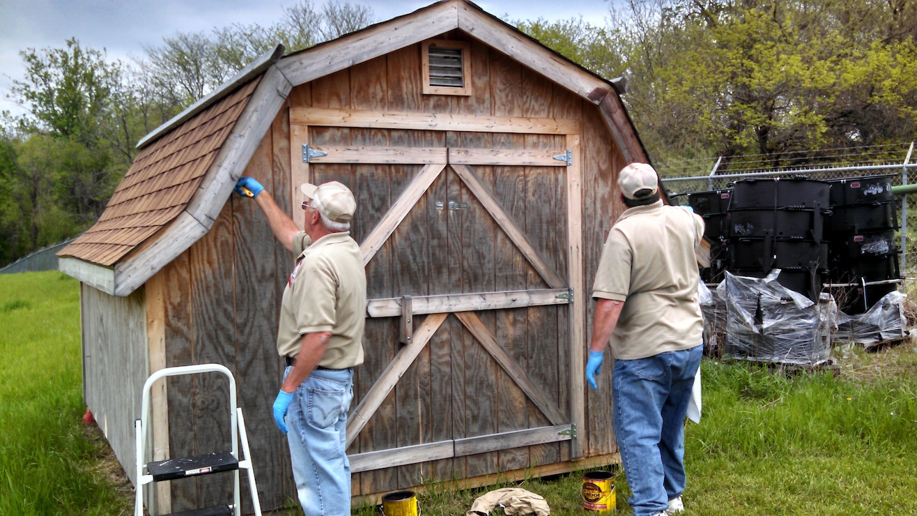 Volunteers staining shed