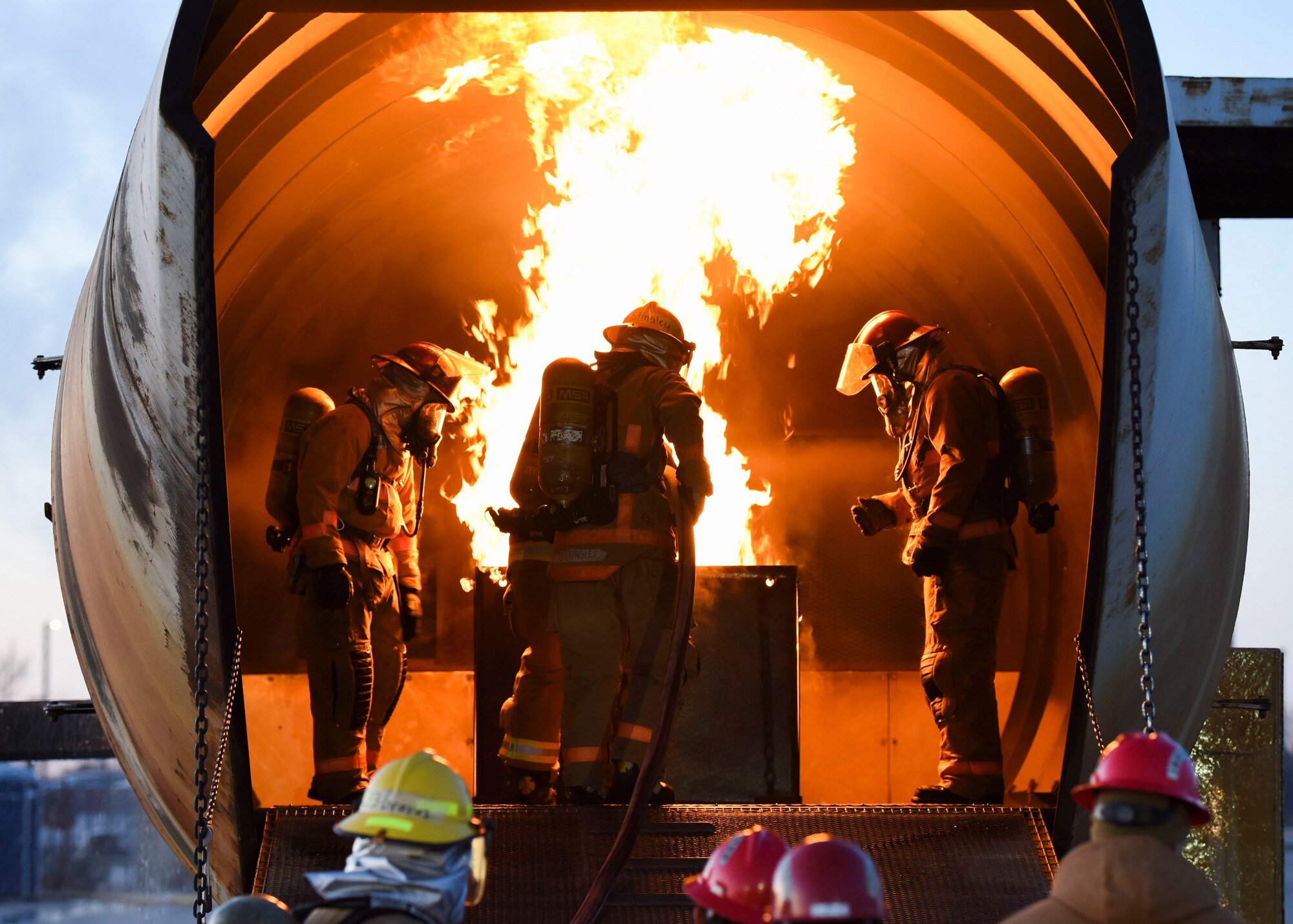 U.S. Air Force Tech. Sgt. Kenneth Colton, 312th Training Squadron fire officer training section chief, instructs joint service members during a fire simulation training at the Louis F. Garland Department of Defense Fire Academy