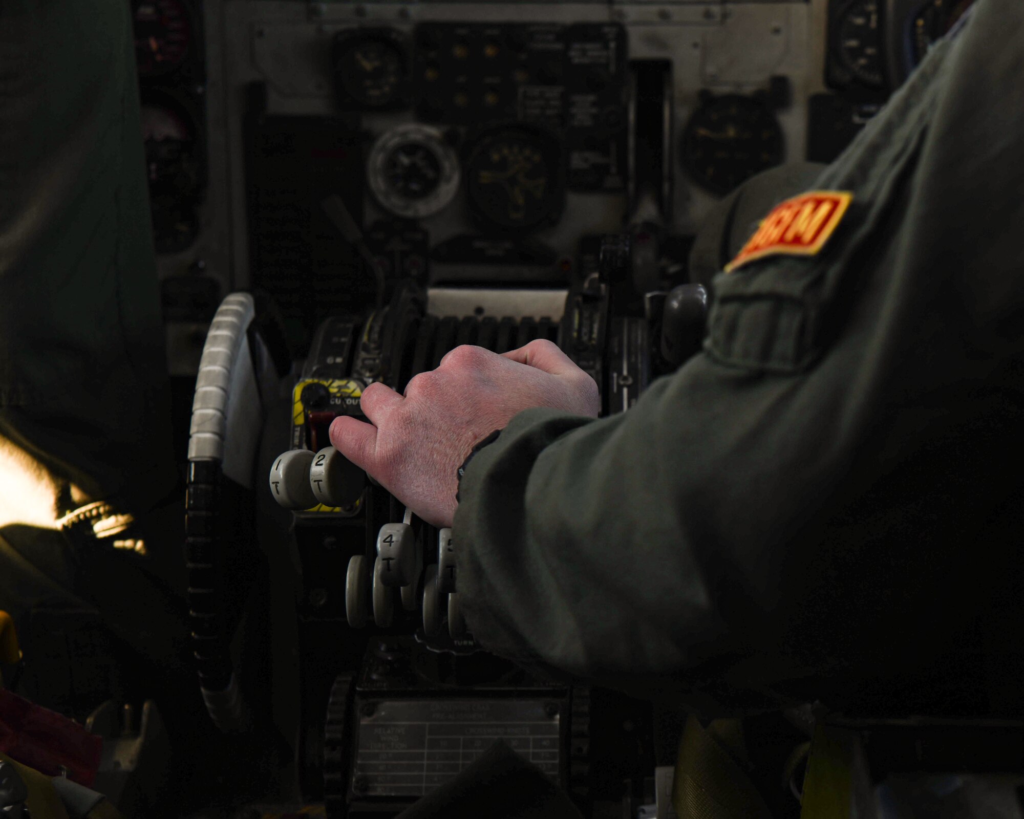 A pilot places his hands on the throttle of the B-52
