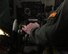 A pilot places his hands on the throttle of the B-52