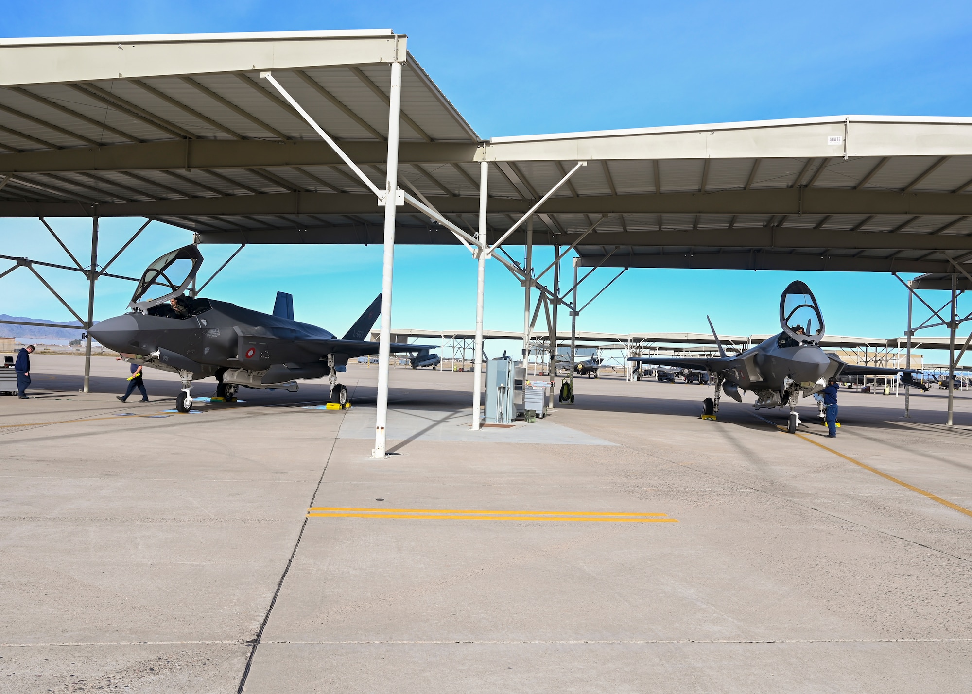 U.S. Air Force Capt. Sean “Echo” Gossner, 63rd Fighter Squadron F-35A Lightning II instructor pilot (left), and his brother 1st Lt. Nicholas “Trek” Gossner, 308th FS F-35A student pilot (right), prepare for a flight Jan. 12, 2022, at Luke Air Force Base, Ariz.