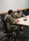 Chief Master Sgt. Cenov talks with an Airman