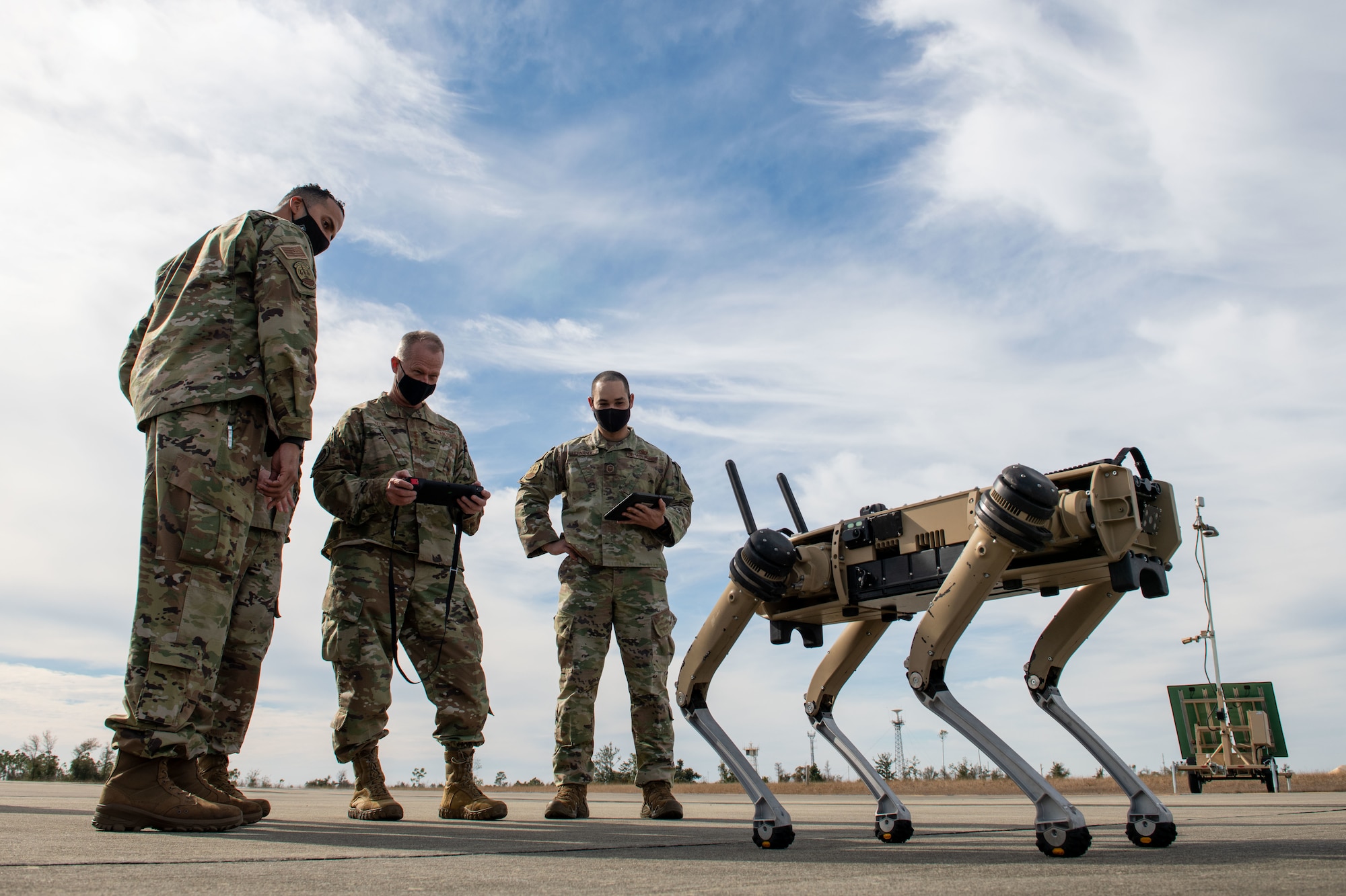 airmen use robot dog