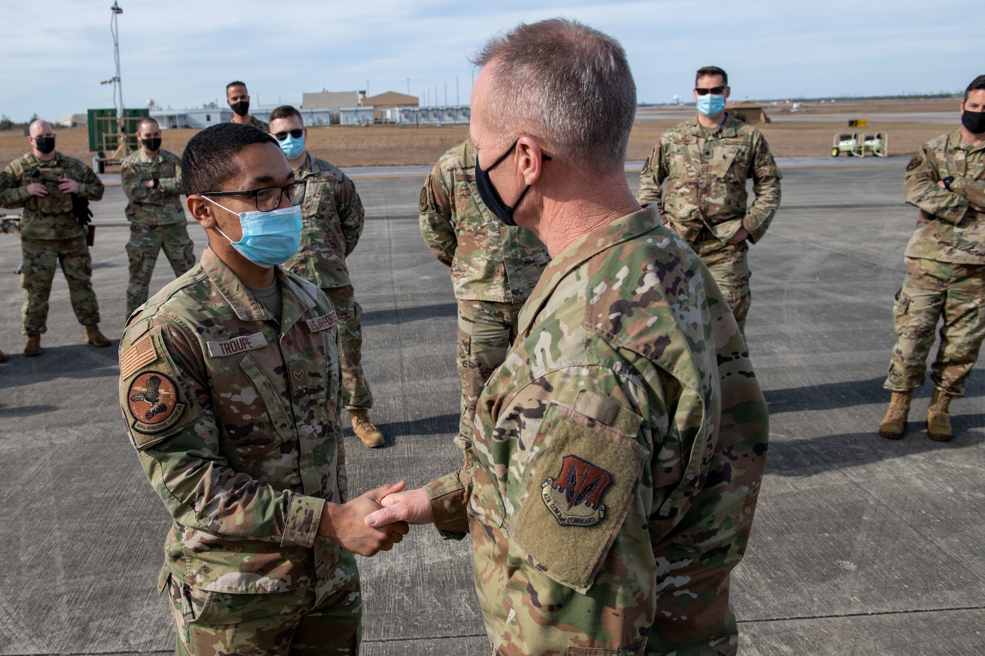 airmen shake hands