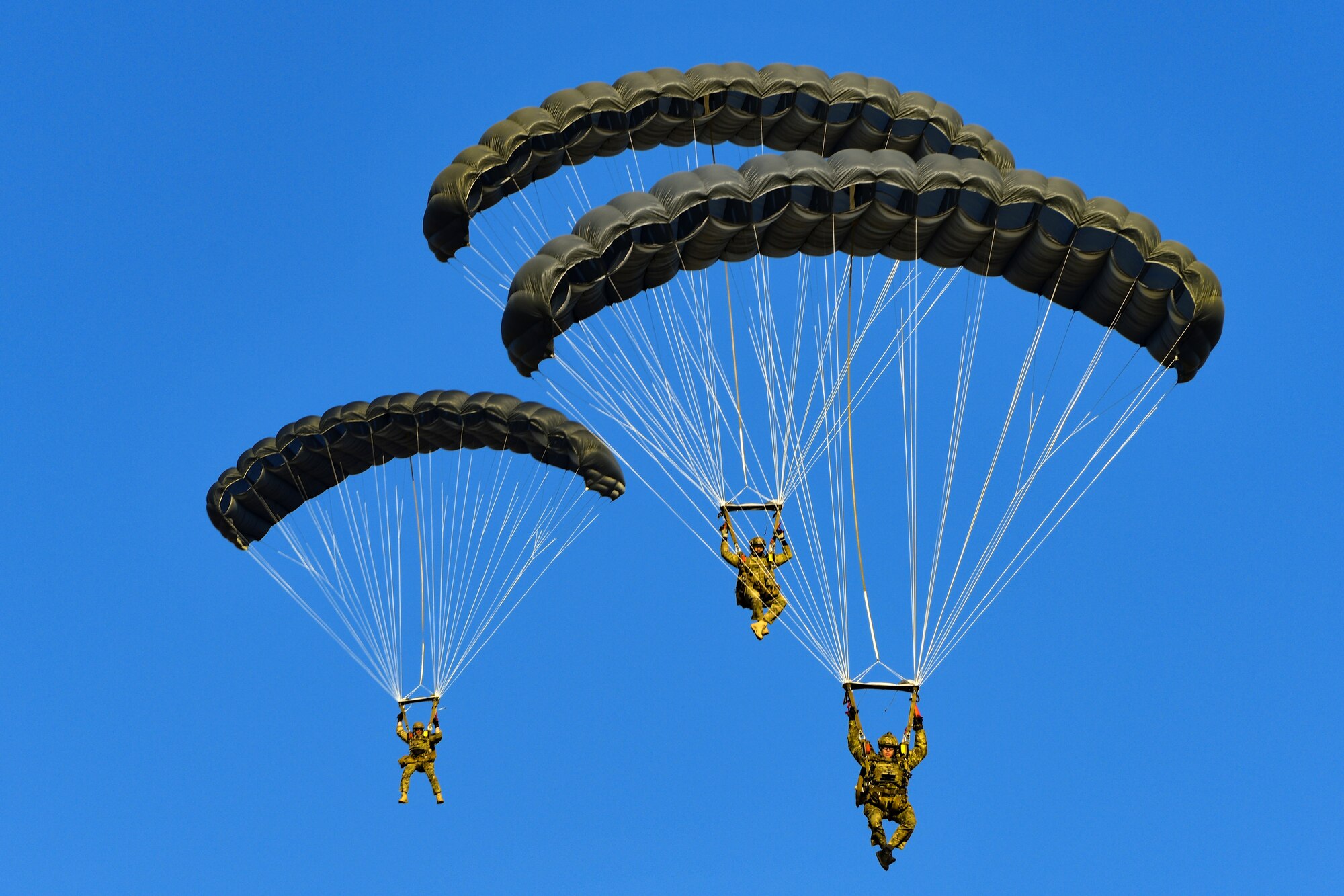 U.S. Air Force pararescuemen from the 57th Rescue Squadron perform a static line jump