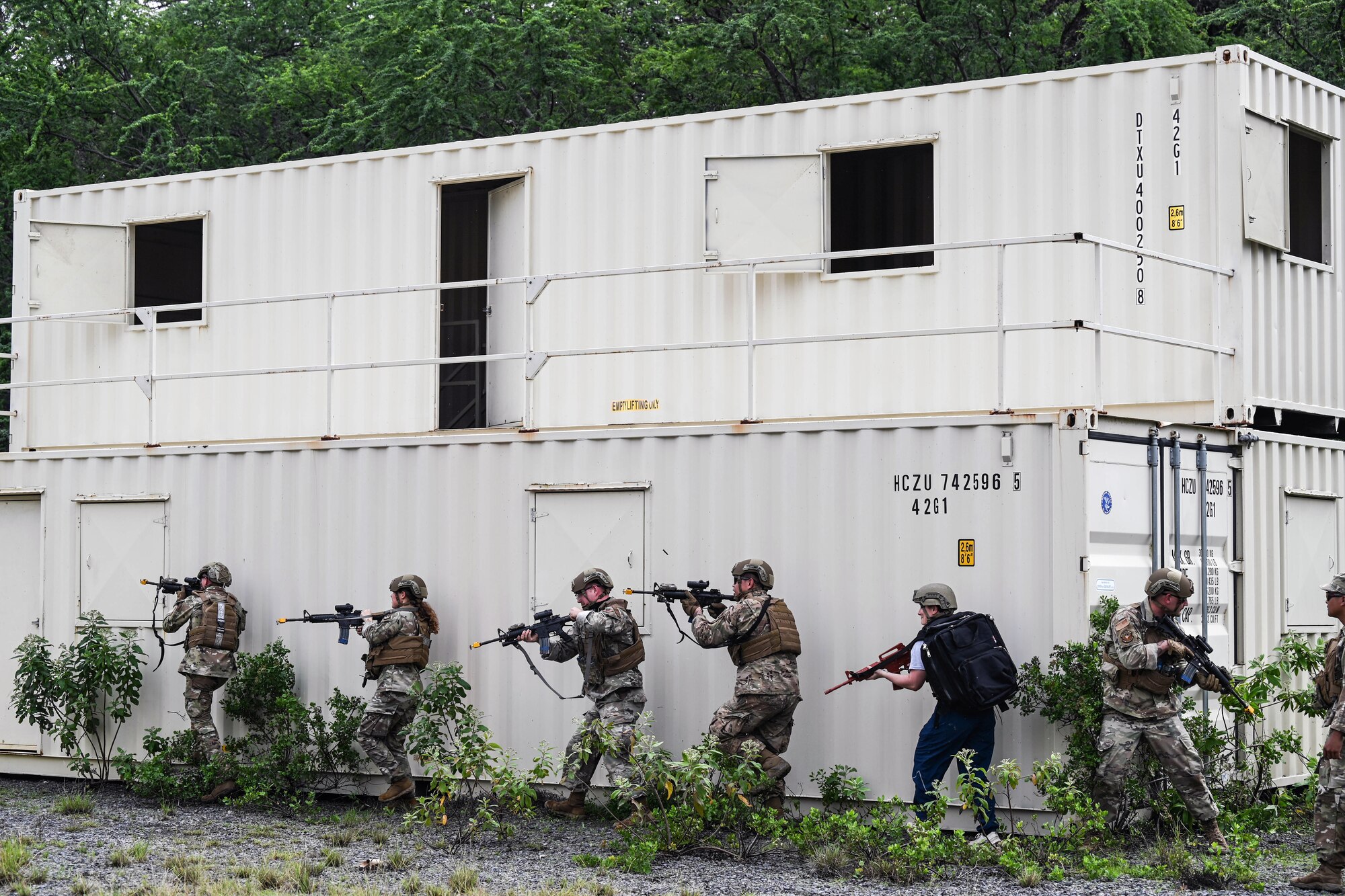 Airmen assigned to the 647th Security Forces Squadron and the 15th Medical Group move in formation