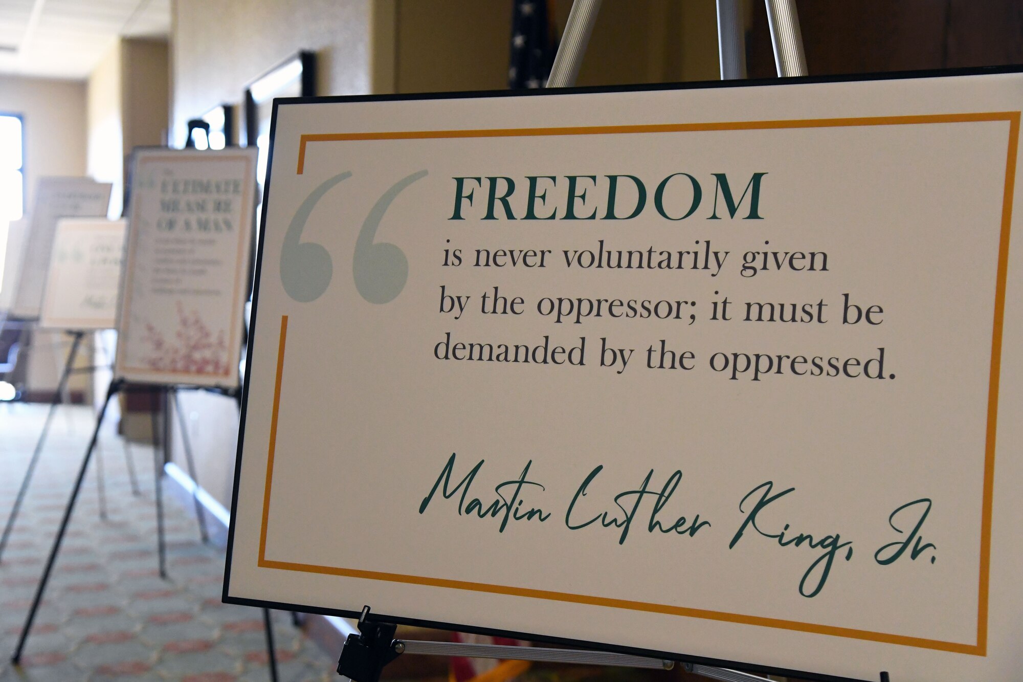 Posters are on display at the annual Dr. Martin Luther King Jr. Celebration Luncheon inside the Bay Breeze Event Center at Keesler Air Force Base, Mississippi, Jan. 27, 2022. The 81st Training Wing and the 81st Training Group hosted the event honoring King's legacy and his efforts to inspire civil rights activism within the African-American community. He is widely regarded as America's pre-eminent advocate of nonviolence and one of the greatest nonviolent leaders in world history. (U.S. Air Force photo by Kemberly Groue)