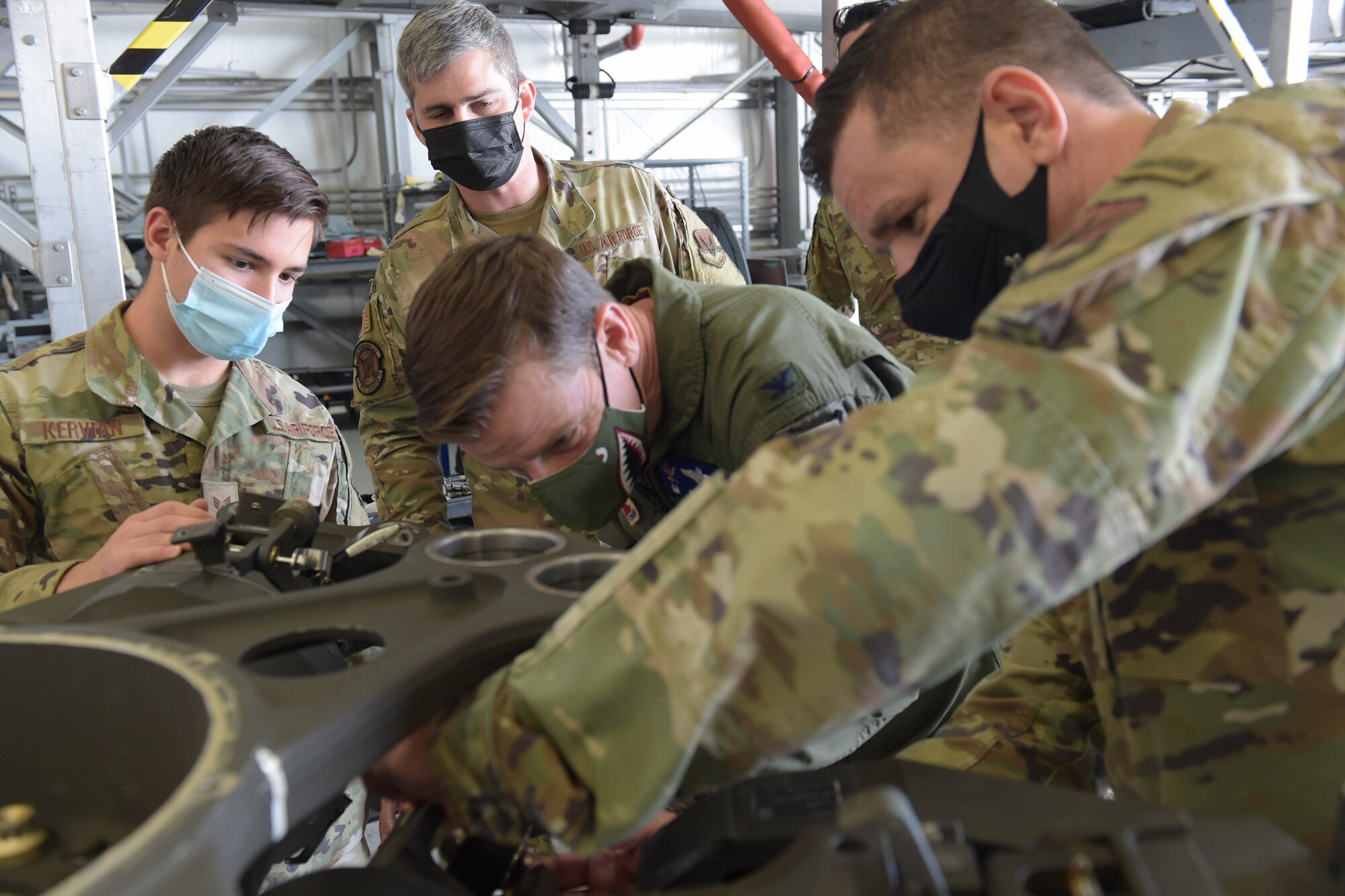 U.S. Air Force Col. Russ Cook, 23rd Wing commander, participates in a maintenance demo during a phase inspection of an HH-60W Jolly Green II helicopter with the help of 41st Rescue Generation Squadron Airmen on Jan. 20, 2022, at Moody Air Force Base, Georgia. The Whiskey is going through its first phase inspection after its first year in service. (U.S. Air Force photo by Airman 1st Class Briana Beavers)