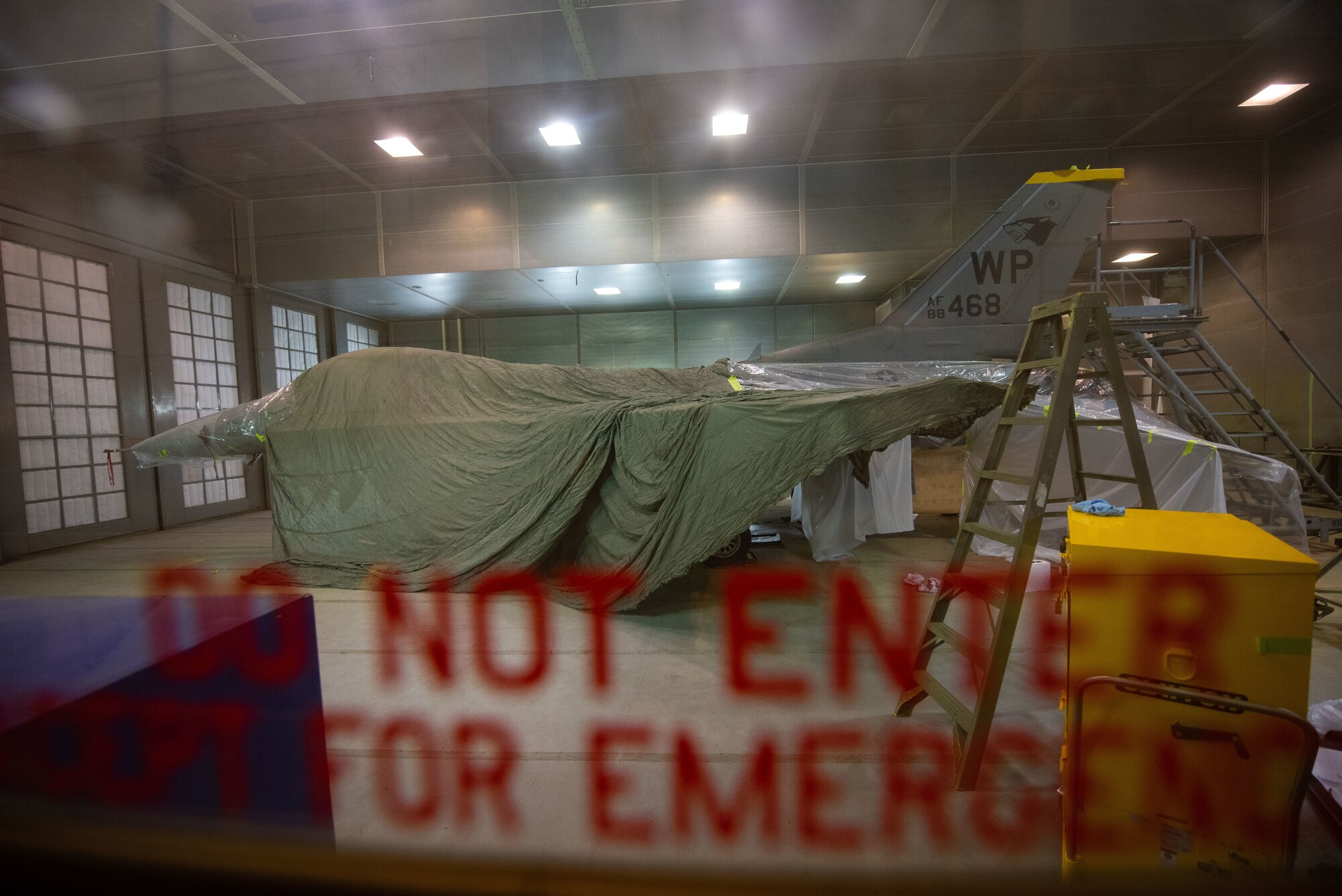 An F-16 Fighting Falcon is prepared to be painted
