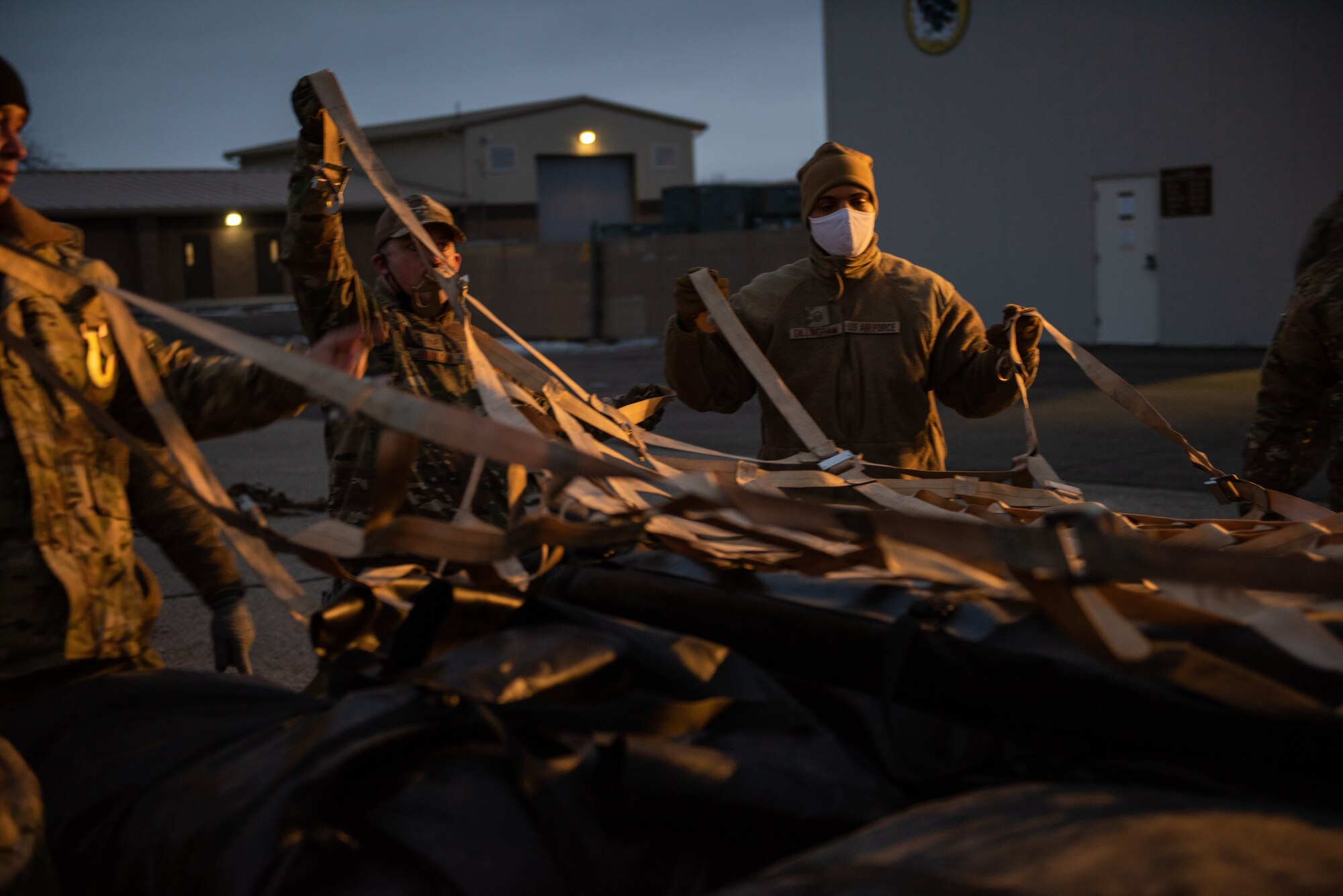 Multiple Airmen prepare cargo during Multi-capable Airman Training. 