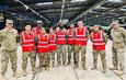 The 405th Army Field Support Brigade commander, Col. Brad Bane, and the Army Field Support Battalion-Benelux commander, Lt. Col. Aaron Jones, pose for a group photo with eight Soldier mechanics from B Company, 553rd Division Sustainment Support Battalion, 1st Cavalry Division Sustainment Brigade. The Fort Hood, Texas, Soldiers are attached to the 16th Sustainment Brigade, 21st Theater Sustainment Command while in Europe. They supported the 405th AFSB at its Army Prepositioned Stock-2 worksite in Eygelshoven, Netherlands recently, conducting 127 quality assurance inspections, 76 radio inspections and four inventories of shop equipment. They also repaired eight deadlined vehicles and brought 106 pieces of equipment up to safety code. (U.S. Army courtesy photo)
