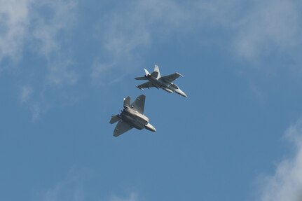 A Hawaii Air National Guard F-22 Raptor and a Navy Reserve VAQ-209 EA-18G Growler execute combat air-to-air exercises Jan. 21, 2022, Joint Base Pearl Harbor-Hickam, Hawaii. The exercise provided participants a multifaceted, joint venue with supporting infrastructure and personnel.