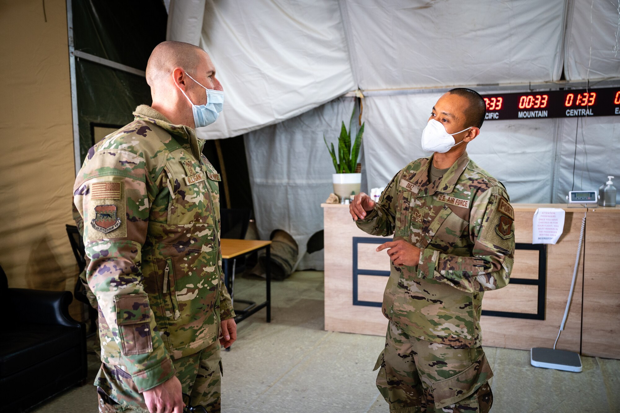 U.S. Air Force Staff Sgt. Macrino Diaz (right), 332d Expeditionary Logistics Readiness Squadron passenger service representative, explains procedures to Chief Master Sgt. Sean M. Milligan, 332d Air Expeditionary Wing command chief during the Command Chief’s immersion visit in Southwest Asia, Jan. 29, 2022. Chief Milligan's immersion visits give him a better understanding of the unique skillsets every Airman brings to the 332d AEW Red Tail team. (U.S. Air Force photo by Master Sgt. Christopher Parr)