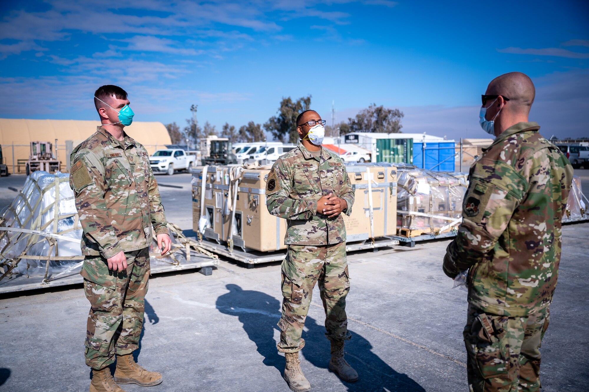 U.S. Air Force Staff Sgt. Austin Edwards and Tech. Sgt. Charles Williams, 332d Expeditionary Logistics Readiness Squadron, provide Chief Master Sgt. Sean M. Milligan, 332d Air Expeditionary Wing command chief, an overview of ground transportation operations during the Command Chief’s immersion visit in Southwest Asia, Jan. 29, 2022. Chief Milligan's immersion visits give him a better understanding of the unique skillsets every Airman brings to the 332d AEW Red Tail team. (U.S. Air Force photo by Master Sgt. Christopher Parr)