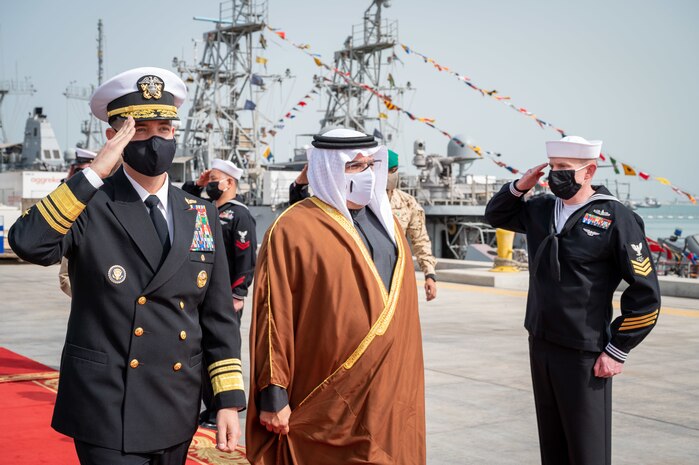 220131-N-OC333-1020 MANAMA, Bahrain (Jan. 31, 2022) His Royal Highness Prince Salman bin Hamad Al-Khalifa, Crown Prince, Deputy Supreme Commander and Prime Minister of Bahrain, and Vice Adm. Brad Cooper, commander of U.S. Naval Forces Central Command, U.S. 5th Fleet and Combined Maritime Forces, arrive at the pier at Naval Support Activity (NSA) Bahrain, Jan. 31.