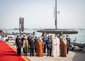 220131-N-OC333-1020 MANAMA, Bahrain (Jan. 31, 2022) His Royal Highness Prince Salman bin Hamad Al-Khalifa, Crown Prince, Deputy Supreme Commander and Prime Minister of Bahrain, and Vice Adm. Brad Cooper, commander of U.S. Naval Forces Central Command, U.S. 5th Fleet and Combined Maritime Forces, arrive at the pier at Naval Support Activity (NSA) Bahrain, Jan. 31.
