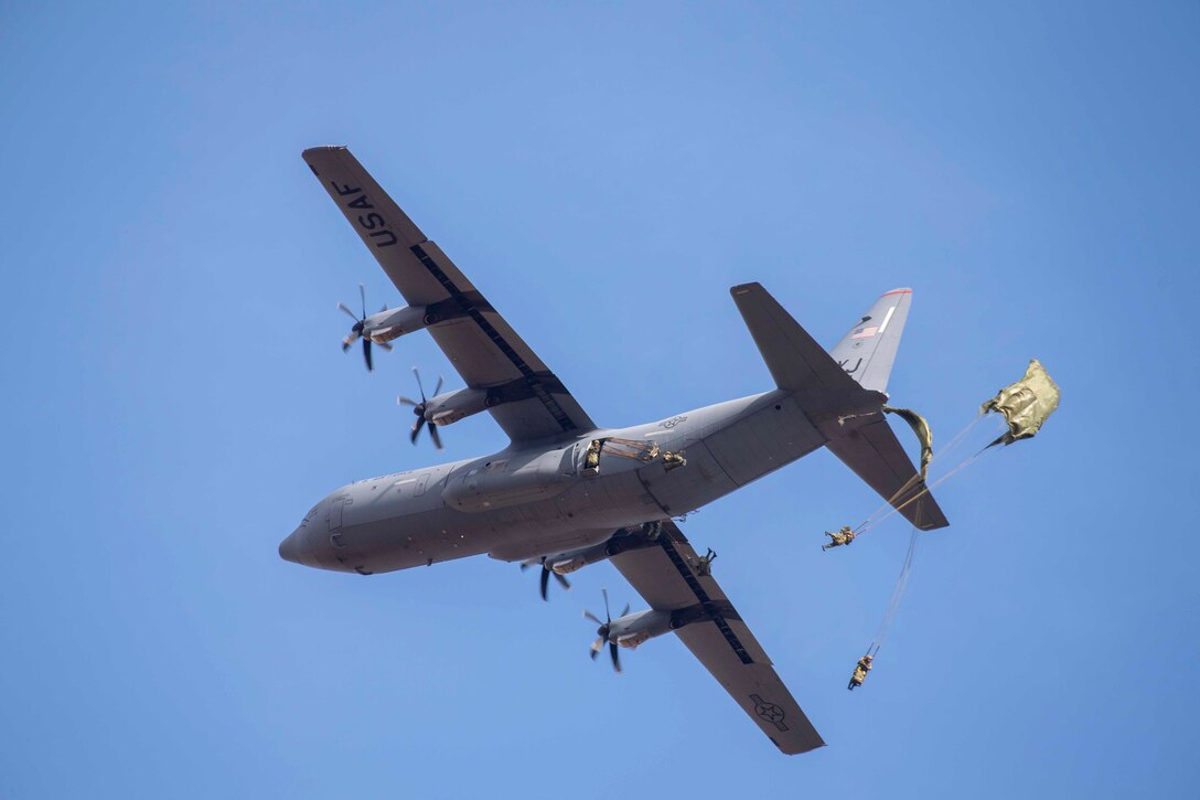 Japan Ground Self-Defense Force paratroopers assigned to the 1st Airborne Brigade jump from a U.S. Air Force C-130J Super Hercules assigned to the 36th Airlift Squadron over Combined Arms Training Center Camp Fuji, Japan, Jan. 25, 2022, during Airborne 22. Airborne 22 involved approximately 540 JGSDF paratroopers, 13 C-130 aircraft and 120 container delivery system bundles. Proper execution of this large-scale ability showcases the strategic importance of engaging in bilateral operations. (U.S. Air Force photo by Senior Airman Brieana E. Bolfing)