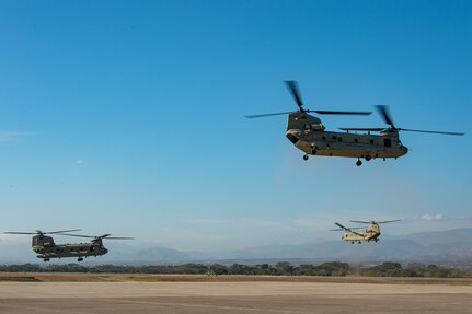 Three CH-47 Chinooks assigned to Joint Task Force Bravo’s 1st Battalion, 228th Aviation Regiment take off from Soto Cano Air Base, Honduras, during the task force’s support to Vice President of the United States Kamala Harris’ visit to Honduras, Jan. 27, 2022.