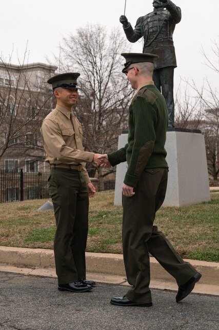 At a commissioning ceremony held on Jan. 28, 2022, 1st Lt. Darren Lin was officially announced as Assistant Director of "The President's Own" United States Marine Band. 1st Lt. Lin returns the first salute rendered to him by Marine Band percussionist SSgt. Michael Hopkins. The first salute is an old U.S. military tradition in which newly commissioned officers give a silver dollar to the person from whom they receive their very first salute.

(U.S. Marine Corps Photos by Staff Sgt. Chase Baran/Released)