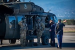 Vice President of the United States Kamala Harris salutes before boarding a UH-60 Blackhawk helicopter at Soto Cano Air Base, Honduras, Jan. 27, 2022.