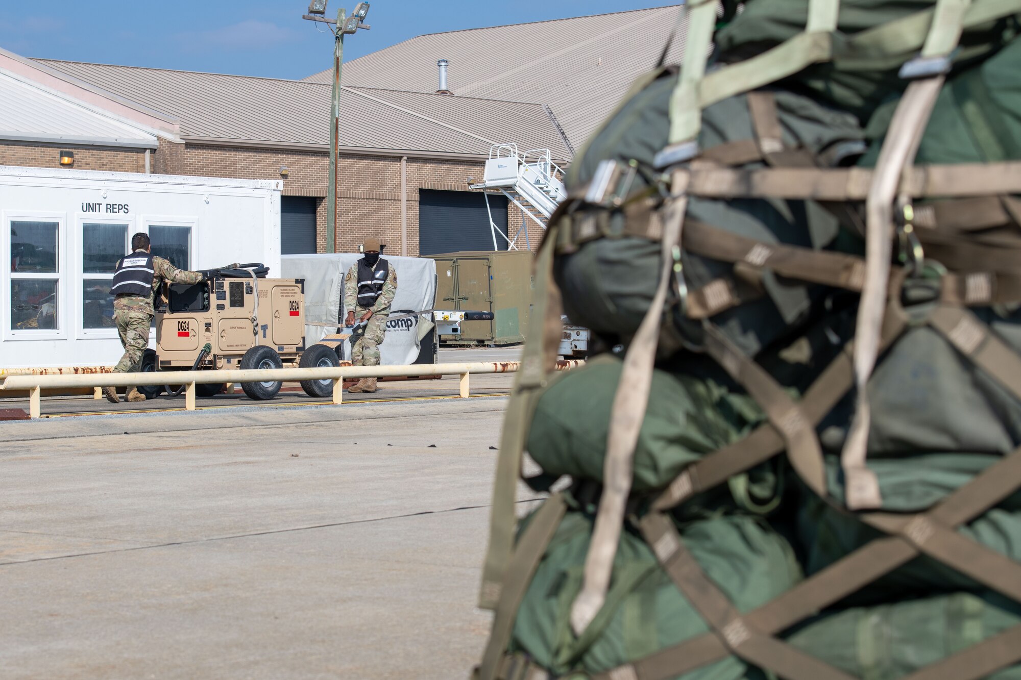 Photo of Airmen moving equipment.