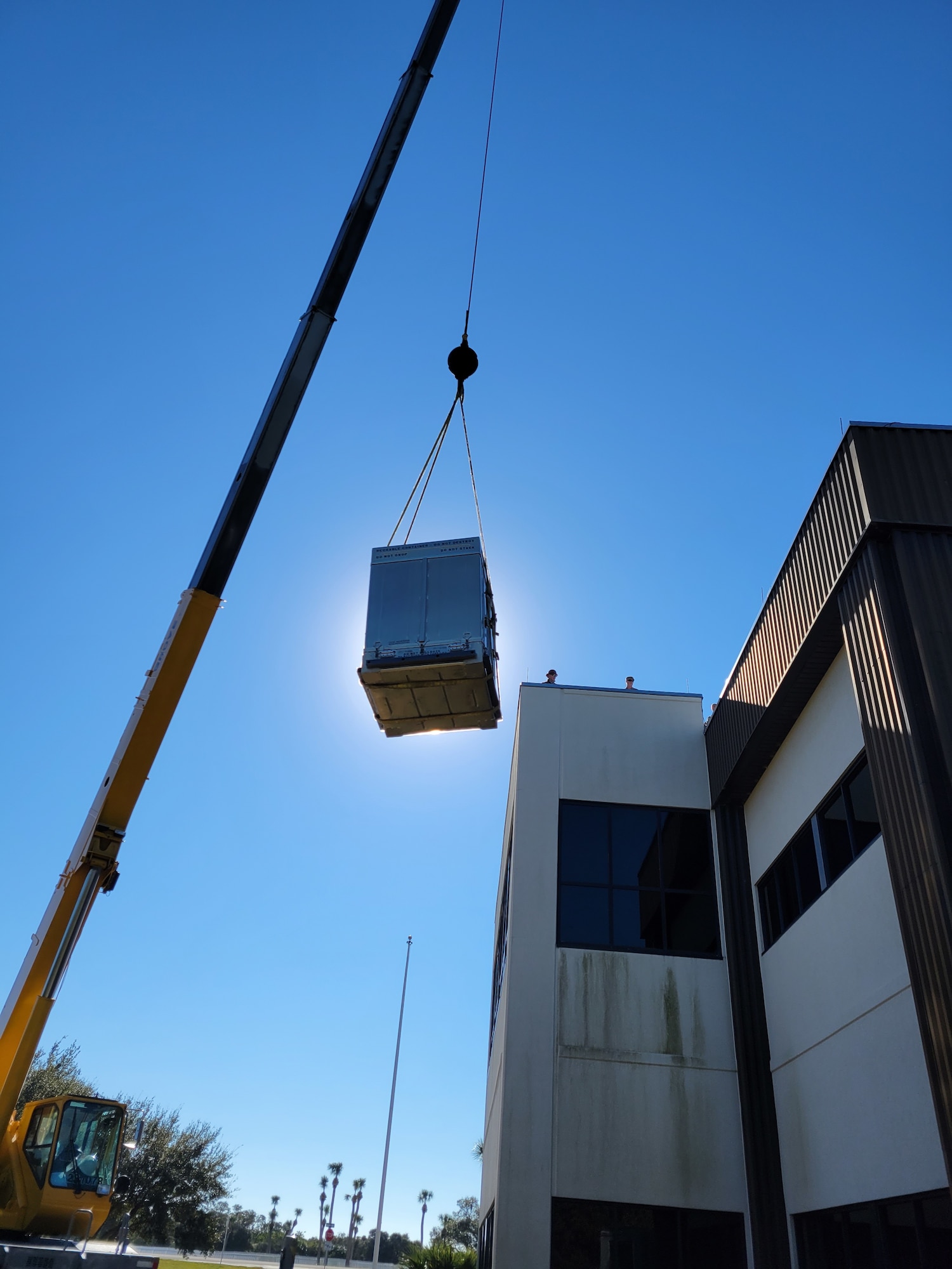 Airmen from the 2d Combat Weather Systems Squadron use a crane to install a Portable Doppler Radar weather system to assist Guardians with space launch operations at Cape Canaveral Space Force Station, Florida.