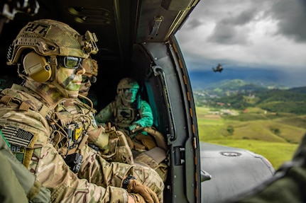U.S. Army Soldiers assigned to 1st Battalion, 54th Security Force Assistance Brigade ride in a Eurocopter AS532 Cougar during Southern Vanguard 22 in Lorena, Brazil, Dec. 7, 2021. U.S. and Brazilian army soldiers took part in the air assault exercise, which was the largest deployment of a U.S Army unit to train with the Brazilian army forces in Brazil. (U.S Army photo by Pfc. Joshua Taeckens)