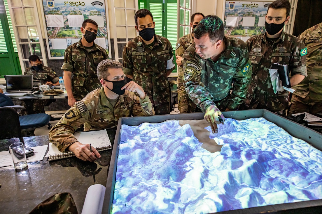 U.S. and Brazilian army soldiers plan and prepare for Exercise Southern Vanguard 22 at the 5th Light Infantry Battalion in Lorena, Brazil, Dec. 5, 2021. Southern Vanguard 22 was planned as a 10-day air assault operation and was the largest deployment of a U.S. Army unit to train with the Brazilian army forces in Brazil. (U.S Army photo by Pfc. Joshua Taeckens)