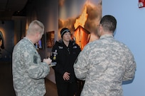 2 Soldiers interviewing Olympic athlete