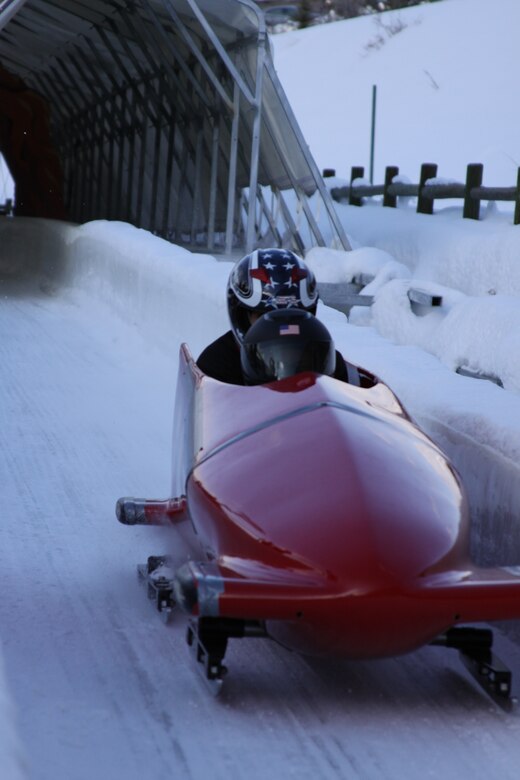 Bobsled moving down track