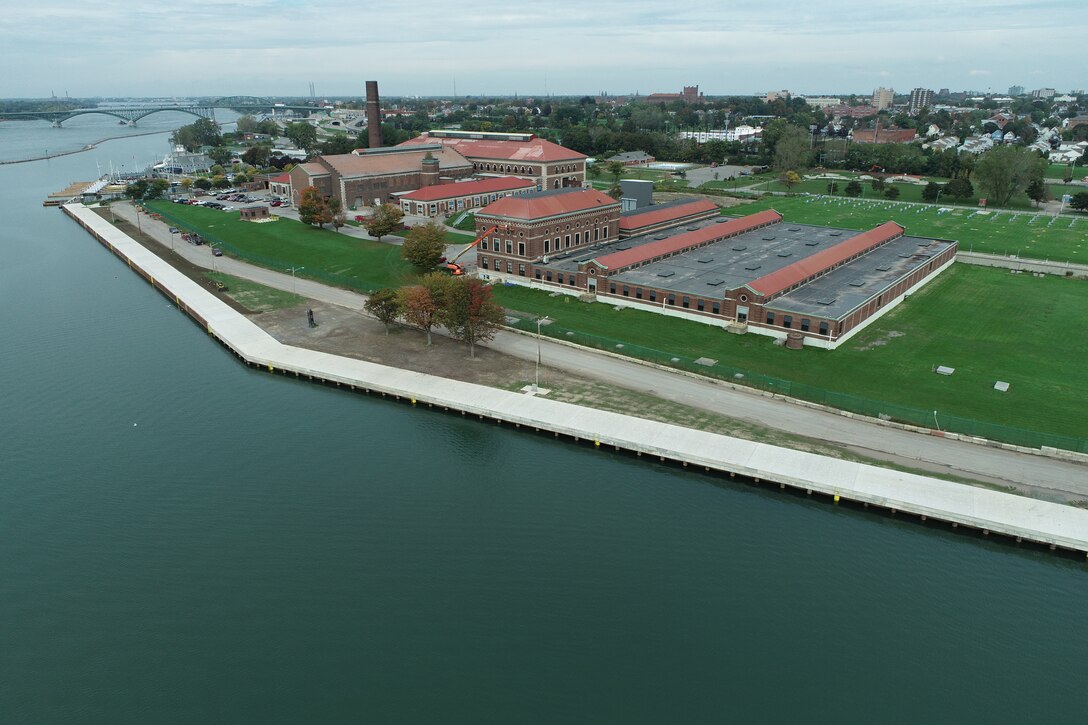 A seawall on Lake Erie, next to a park with a pumping station.