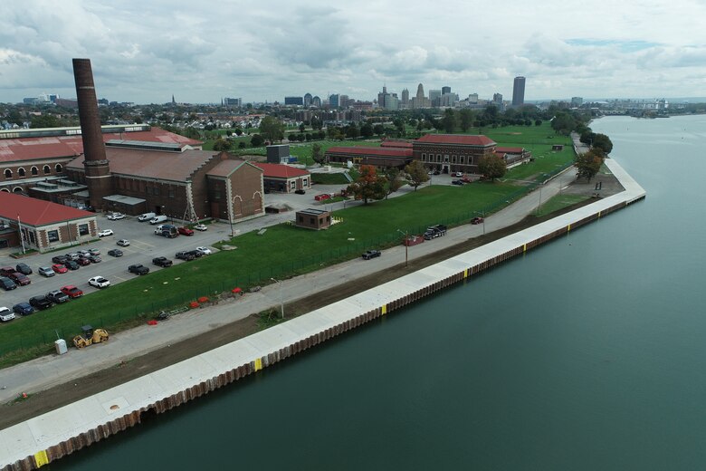 A seawall on Lake Erie, next to a park with a pumping station.