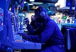 PHILIPPINE SEA (Jan. 29, 2022) Chief Fire Controlman (AEGIS) Travis Taylor, from Newport News, Va., tracks contacts in the combat information center onboard the Arleigh Burke-class guided-missile destroyer USS Fitzgerald (DDG 62) during the bilateral training exercise Ship Anti-Submarine Warfare Readiness Effectiveness Measuring (SHAREM) with the Japan Maritime Self Defense Force. Fitzgerald is on a scheduled deployment in the U.S. 7th Fleet area of operations to enhance interoperability with alliances and partnerships while serving as a ready-response force in support of a free and open Indo-Pacific region. (U.S. Navy photo by Mass Communication Specialist 3rd Class Catie Coyle)