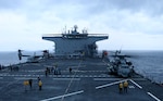 PHILIPPINE SEA (Jan. 28, 2022) An MV-22B Osprey tiltrotor aircraft and a CH-53E Super Stallion helicopter from the 31st Marine Expeditionary Unit (MEU) refuel on the flight deck of USS Miguel Keith (ESB 5). Miguel Keith, assigned to Expeditionary Strike Group 7, is currently operating as the Theater Littoral Warfare Commander's flagship in the U.S. 7th Fleet area of responsibility to enhance interoperability with allies and partners and serve as a ready response force to defend peace and stability in the Indo-Pacific region.