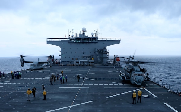 PHILIPPINE SEA (Jan. 28, 2022) An MV-22B Osprey tiltrotor aircraft and a CH-53E Super Stallion helicopter from the 31st Marine Expeditionary Unit (MEU) refuel on the flight deck of USS Miguel Keith (ESB 5). Miguel Keith, assigned to Expeditionary Strike Group 7, is currently operating as the Theater Littoral Warfare Commander's flagship in the U.S. 7th Fleet area of responsibility to enhance interoperability with allies and partners and serve as a ready response force to defend peace and stability in the Indo-Pacific region.