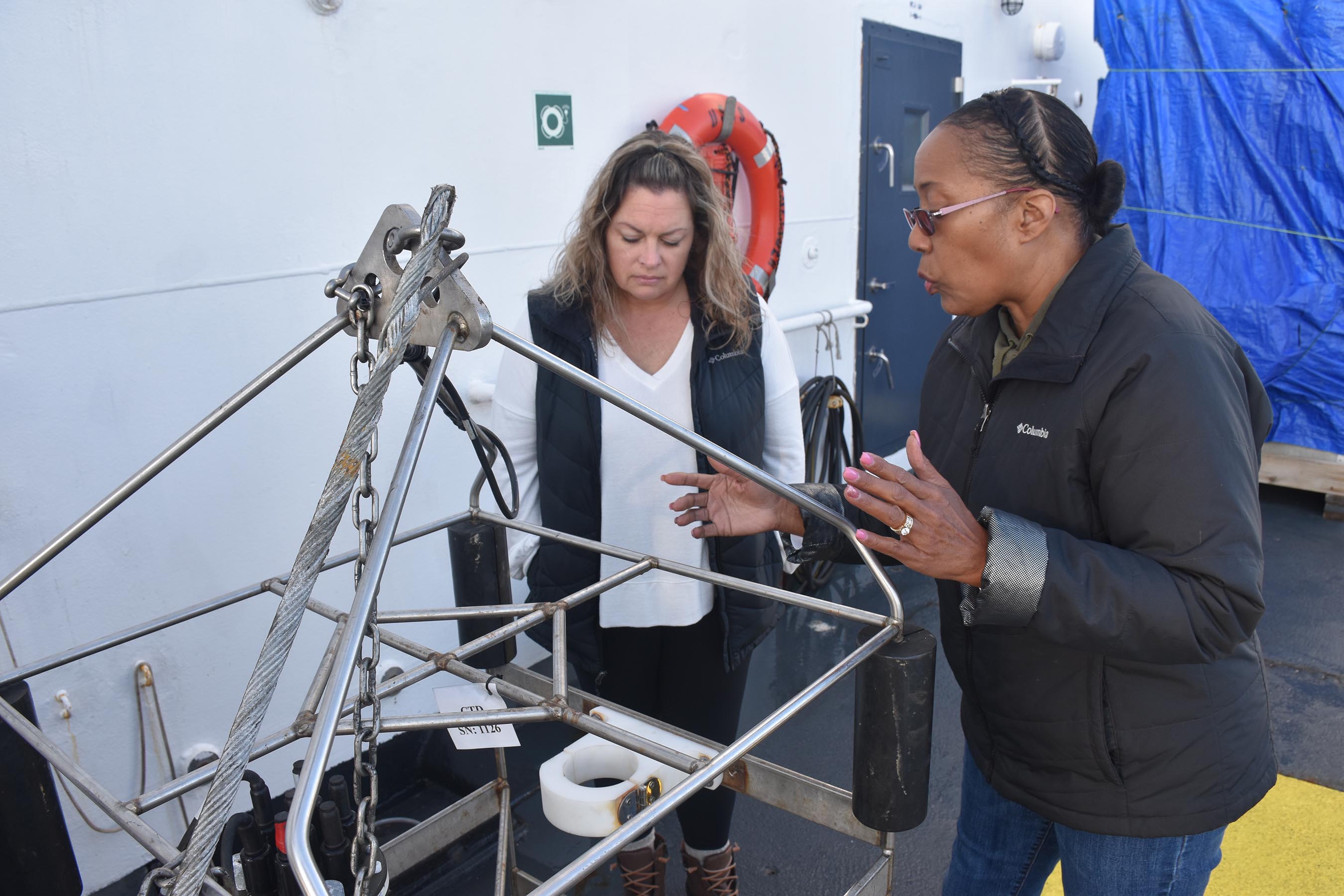 Sailors from U.S. Naval Meteorology and Oceanography Command and staff from Naval Oceanographic Office cast a Conductivity, Temperature, and Depth (CTD) instrument from the Military Sealift Command oceanographic survey ship USNS Pathfinder (T-AGS 60) to measure the conductivity, temperature, and pressure of seawater.