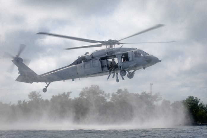 U.S. Marines with Force Company, 2d Reconnaissance Battalion, 2d Marine Division, helocast as part of Littoral Exercise I (LEX I) in Key West, Fla., Jan. 24, 2022. During LEX I, Marines and Sailors aboard the Wichita and on various bases throughout the East Coast will be conducting new types of training to prepare for future scenarios in littoral environments. They will be experimenting with new tactics and training with multi-domain reconnaissance and counter-reconnaissance teams in accordance with Force Design 2030.(U.S. Marine Corps photo by Lance Cpl. Brian Bolin Jr.)