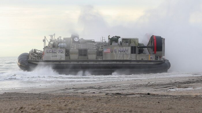 A Landing Craft Air Cushion departs the shore during a Type Commander’s Amphibious Training (TCAT) on Camp Lejeune, North Carolina, Jan. 20, 2022. TCAT is a mobility exercise ashore that allowed Marines with 2d Marine Logistics Group and 2d Marine Division to gain the requisite skills and experience to integrate with the U.S. Navy in follow-on exercises and real-world operations. (U.S. Marine Corps photo by Lance Cpl. Megan Ozaki)