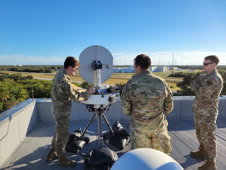 Airmen from the 2d Combat Weather Systems Squadron install a Portable Doppler Radar weather system to assist U.S. Space Force Guardians with space launch operations