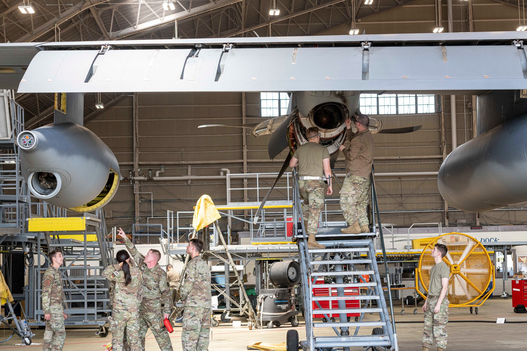 Senior Master Sgt. Noah Shedd, 374th Maintenance Squadron maintenance flight superintendent, explains the function of a refueling pod on a C-130J Super Hercules to a United States Air Force Academy cadets at Yokota Air Base, Japan, June 29, 2022