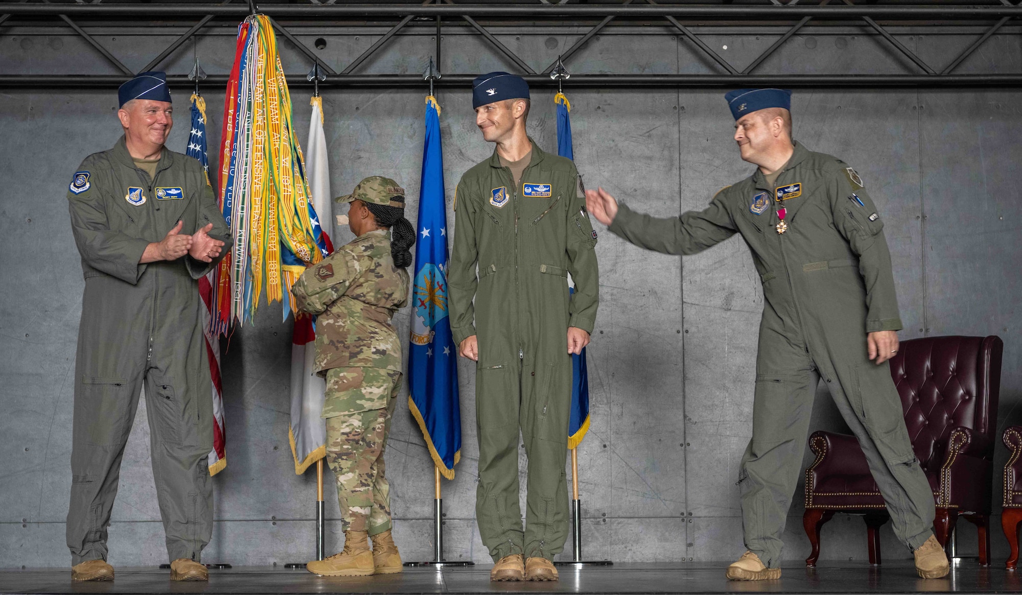 United States Air Force Lt. Gen. Ricky N. Rupp, left, U.S. Forces Japan and 5th Air Force commander, and Col. Jesse J. Friedel, right, 35th Fighter Wing (FW) outgoing commander, congratulate Col. Michael P. Richard, center, 35th FW incoming commander, after his assumption of he assumes command during the 35th FW change of command ceremony at Misawa Air Base, Japan, June 30, 2022.