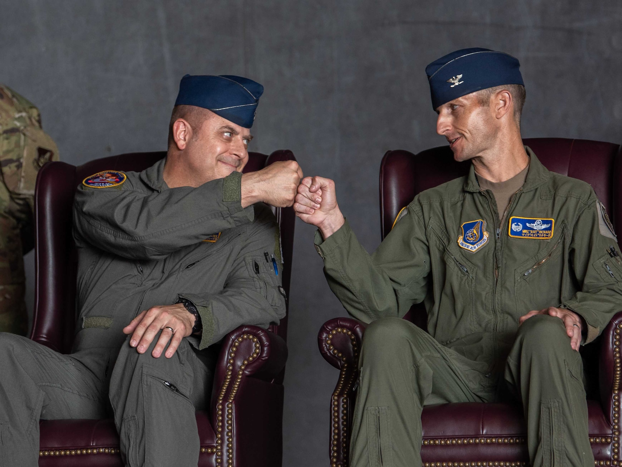 United States Air Force Col. Jesse J. Friedel, left, 35th Fighter Wing (FW) outgoing commander, congratulates Col. Michael P. Richard, right, 35th FW incoming commander, after remarks from Lt. Gen. Ricky N. Rupp, U.S. Forces Japan and 5th Air Force commander, during the 35th FW change of command ceremony at Misawa Air Base, Japan, June 30, 2022.