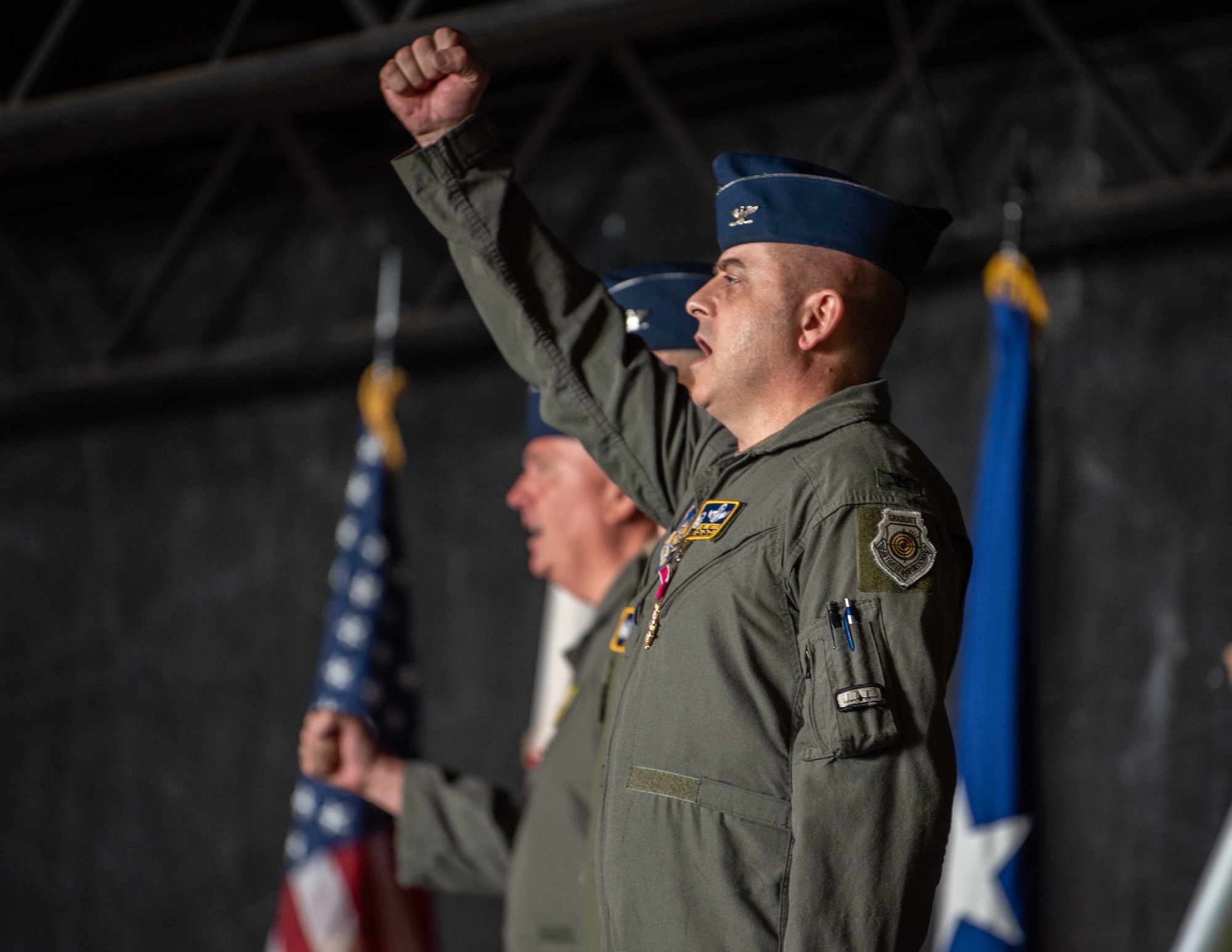 United States Air Force Col. Jesse J. Friedel, 35th Fighter Wing (FW) outgoing commander, sings the Air Force song during the 35th FW change of command ceremony at Misawa Air Base, Japan, June 30, 2022.