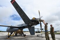 U.S. Air Force members of the 119th Wing adjust propeller weight during MQ-9 preflight checks at Andersen Air Force Base, Guam, during Exercise Valiant Shield May 27, 2022. The 12-day joint field training exercise enhanced integration between U.S. forces during joint operations at sea, on land, in air, and in cyberspace.