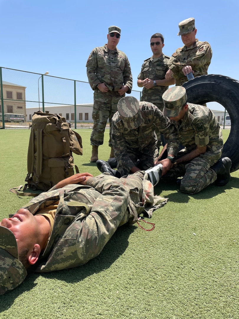 Airmen with the 137th Special Operations Medical Group, Oklahoma Air National Guard, observe Azerbaijan Operational Capabilities Concept Battalion medical personnel treat a simulated combat casualty during a State Partnership Program visit to Baku, Azerbaijan, June 20-24, 2022.