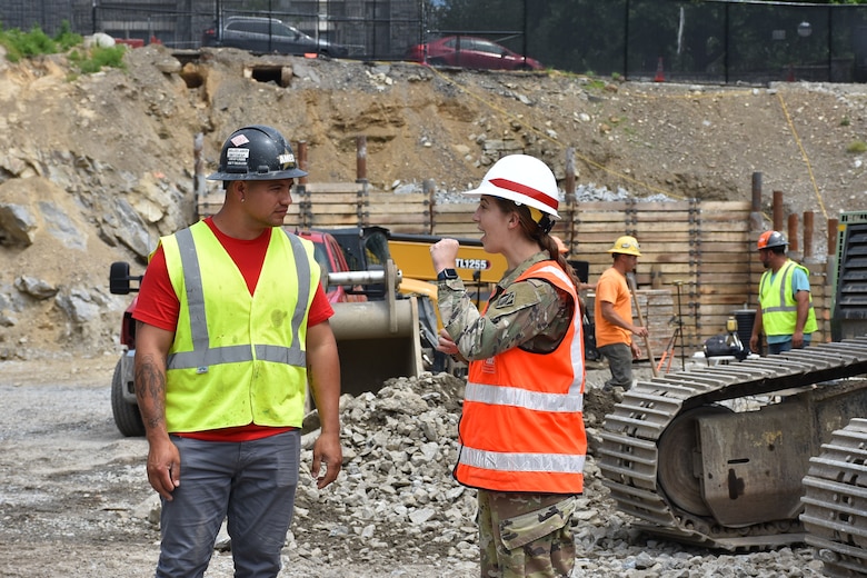 First Lieutenant Anne Schreiner walks the Cyber and Engineering Academic Center (CEAC) construction site at the U.S. Military Academy at West Point.