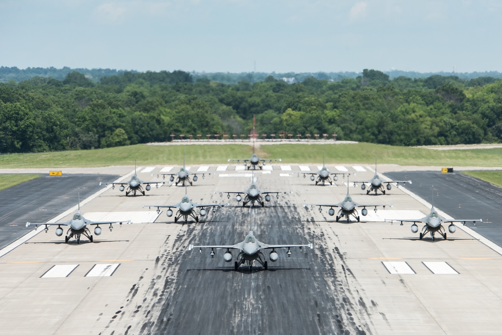 F-16 Vipers from the 138th Fighter Wing participate in an elephant walk, June 4, 2021, at the Tulsa Air National Guard Base, Okla. The elephant walk was part of a large-scale readiness exercise that was conducted to test the wing's ability to rapidly deploy combat ready forces across the globe. (Oklahoma Air National Guard photo by Tech. Sgt. Rebecca Imwalle)