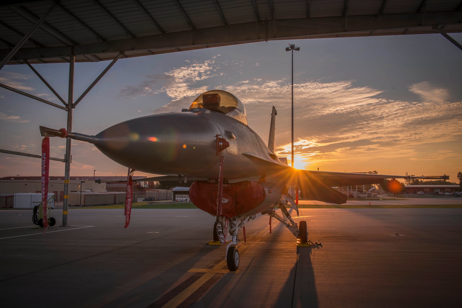 An F-16 sits ready for a new day of activities, Sep. 14, 2016, as an early morning sunrise breaks over the horizon at Tulsa Air National Guard base, Tulsa, OK.



(U.S. Air National Guard photo by Tech. Sgt. Drew A. Egnoske)