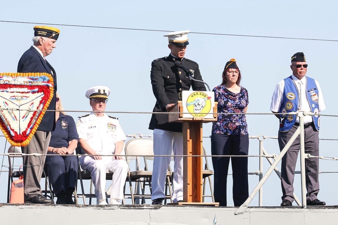 U.S. Marine Capt. David Chang, the executive officer at Recruiting Station Cleveland, delivers a speech during a Memorial Day event aboard the USS Cod (SS-224),  a WWII-era submarine in Cleveland, OH., May 30, 2022. Chang was the guest speaker at the Memorial Day event. (U.S. Marine photo by Sgt. Nello Miele)